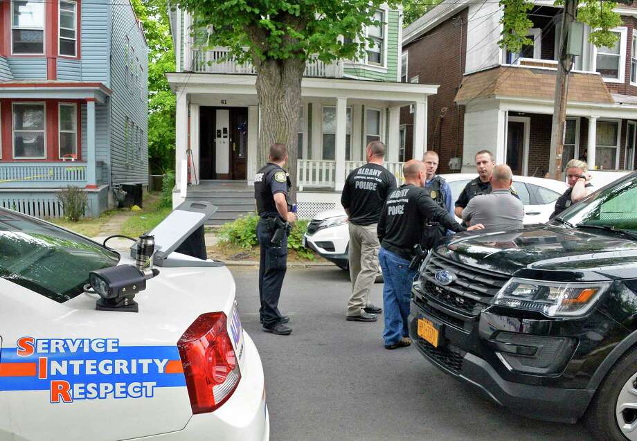 Police continue to investigate at 61 Partridge Street, center, Saturday June 23, 2018 in Albany, NY. Albany police shot and killed a 20-year-old man as he was stabbing his mother in the face inside the home late Friday night.  (John Carl D'Annibale/Times Union) Photo: John Carl D'Annibale