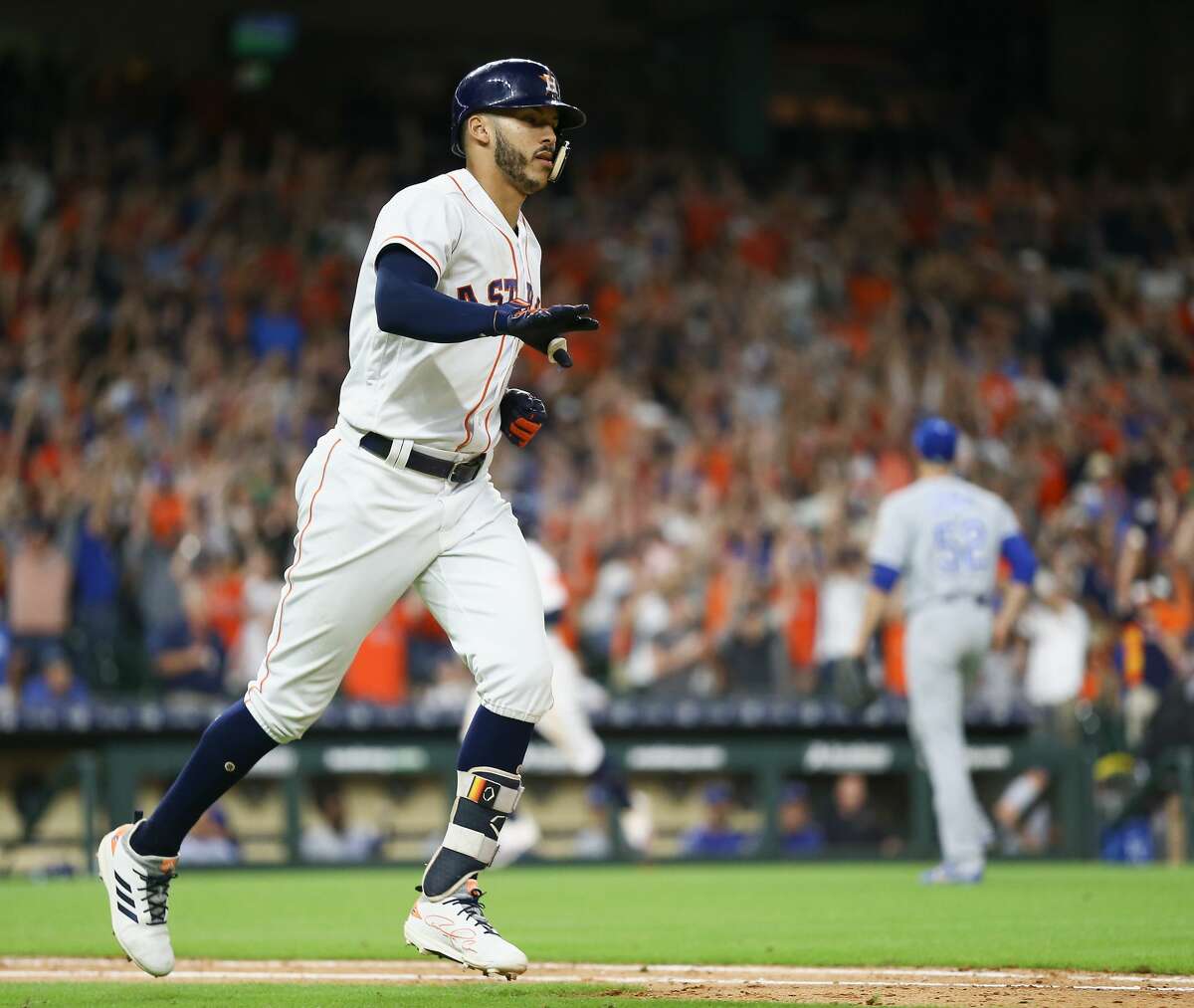 HOUSTON, TX - JUNE 23: Carlos Correa #1 of the Houston Astros hits a walkoff single in the twelfth inning against the Kansas City Royals for a 4-3 win at Minute Maid Park on June 23, 2018 in Houston, Texas. (Photo by Bob Levey/Getty Images)