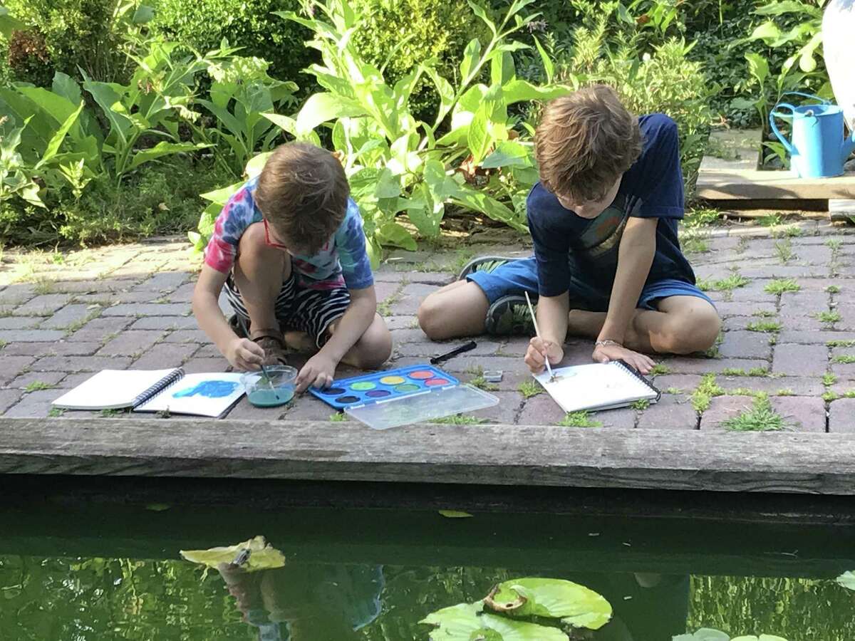 Homeschoolers paint during a nature study at the Garden of Ideas in Ridgefield.