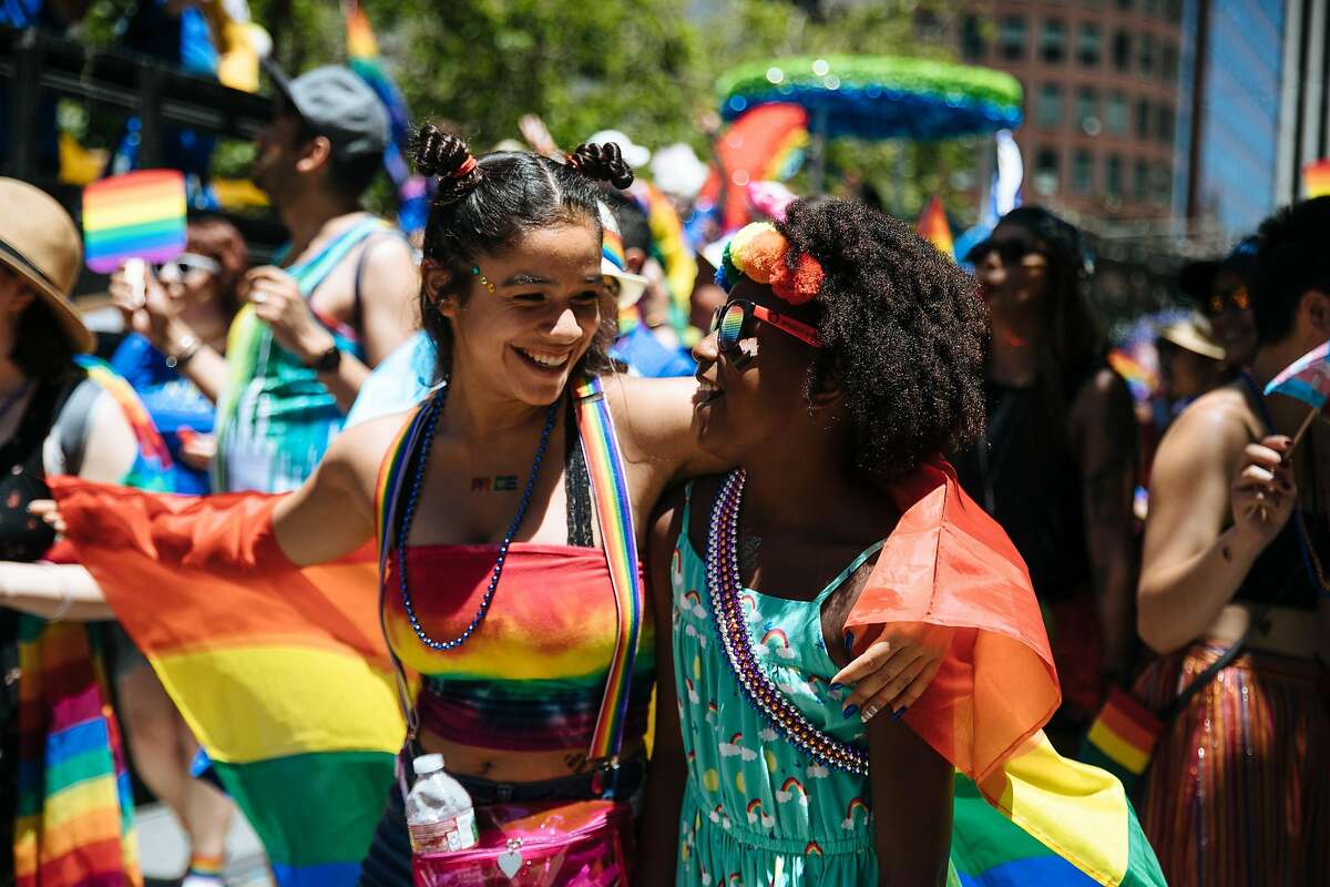 Addison Mullins, left, and Georgia Mullins, right, embrace each other during the San Francisco Pride Parade in San Francisco , Calif., on Sunday, June 24, 2018.