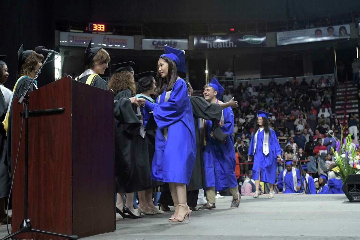Albany High School graduates walk across the stage to receive their diplomas during their graduation at the Times Union Center on Sunday, June 24, 2018, in Albany, N.Y. (Paul Buckowski/Times Union)