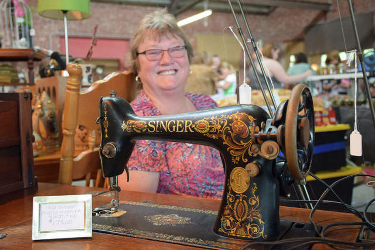 Janet Presley and a 1910 Singer sewing machine.
