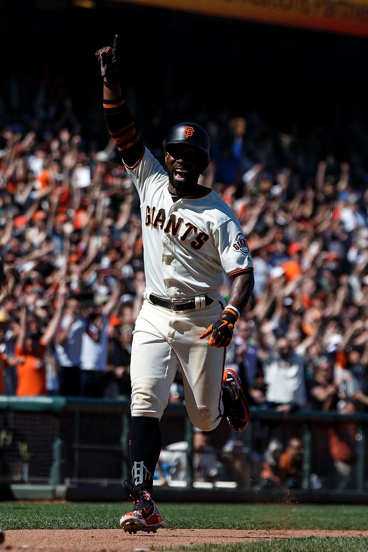 SAN FRANCISCO, CA - JUNE 24: Andrew McCutchen #22 of the San Francisco Giants celebrates while scoring on a two run walk off double by Hunter Pence (not pictured) against the San Diego Padres during the eleventh inning at AT&T Park on June 24, 2018 in San Francisco, California. The San Francisco Giants defeated the San Diego Padres 3-2 in 11 innings. (Photo by Jason O. Watson/Getty Images)