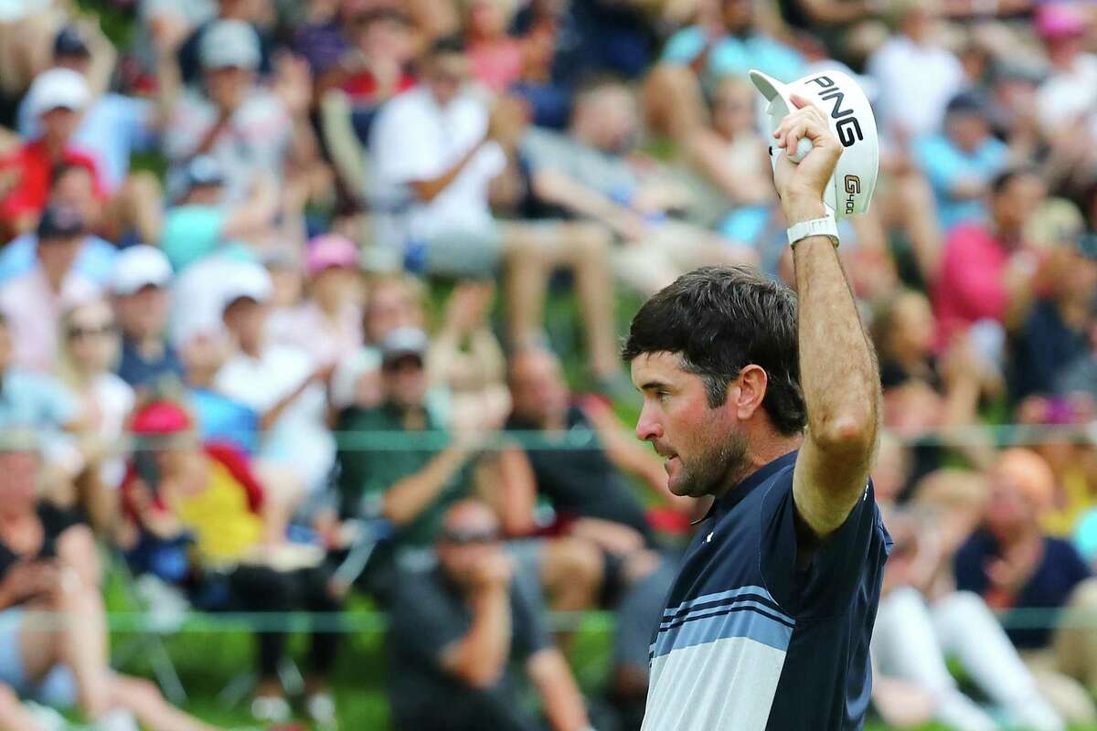CROMWELL, CT - JUNE 24: Bubba Watson of the United States waves to the gallery after making a putt for birdie on the 18th green during the final round of the Travelers Championship at TPC River Highlands on June 24, 2018 in Cromwell, Connecticut. (Photo by Tim Bradbury/Getty Images)