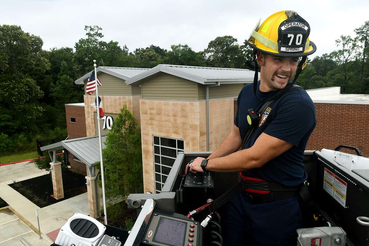 Apparatus Operator Shawn Maya works the ladder at Spring Fire Dept. Station 70 on June 19, 2018. (Jerry Baker/For the Chronicle)