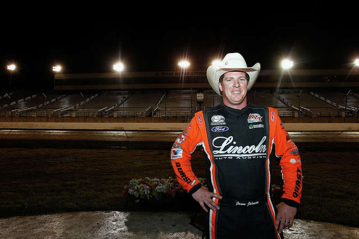 Jason Johnson celebrates in the victory lane after winning the Port-A-Cool U.S. National Dirt Track Championship at Texas Motor Speedway in 2013 in Fort Worth, Texas. Johnson died Saturday in a race in Wisconsin.