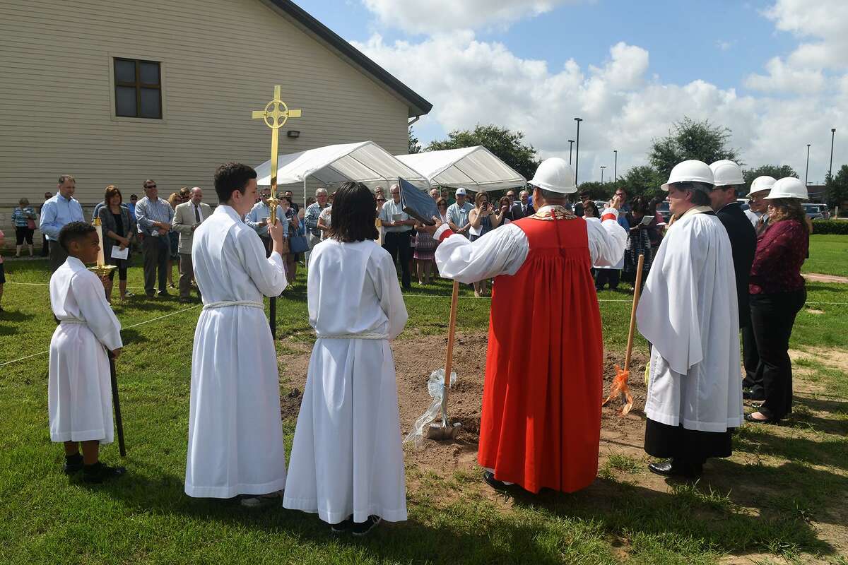 The Right Reverend and Bishop Assistant Hector Monterroso, center, blesses the site of the new Altar while leading the groundbreaking ceremony for a new proposed building at St. Aidan's Episcopal Church in Cypress on June 23, 2018. (Jerry Baker/For the Chronicle)