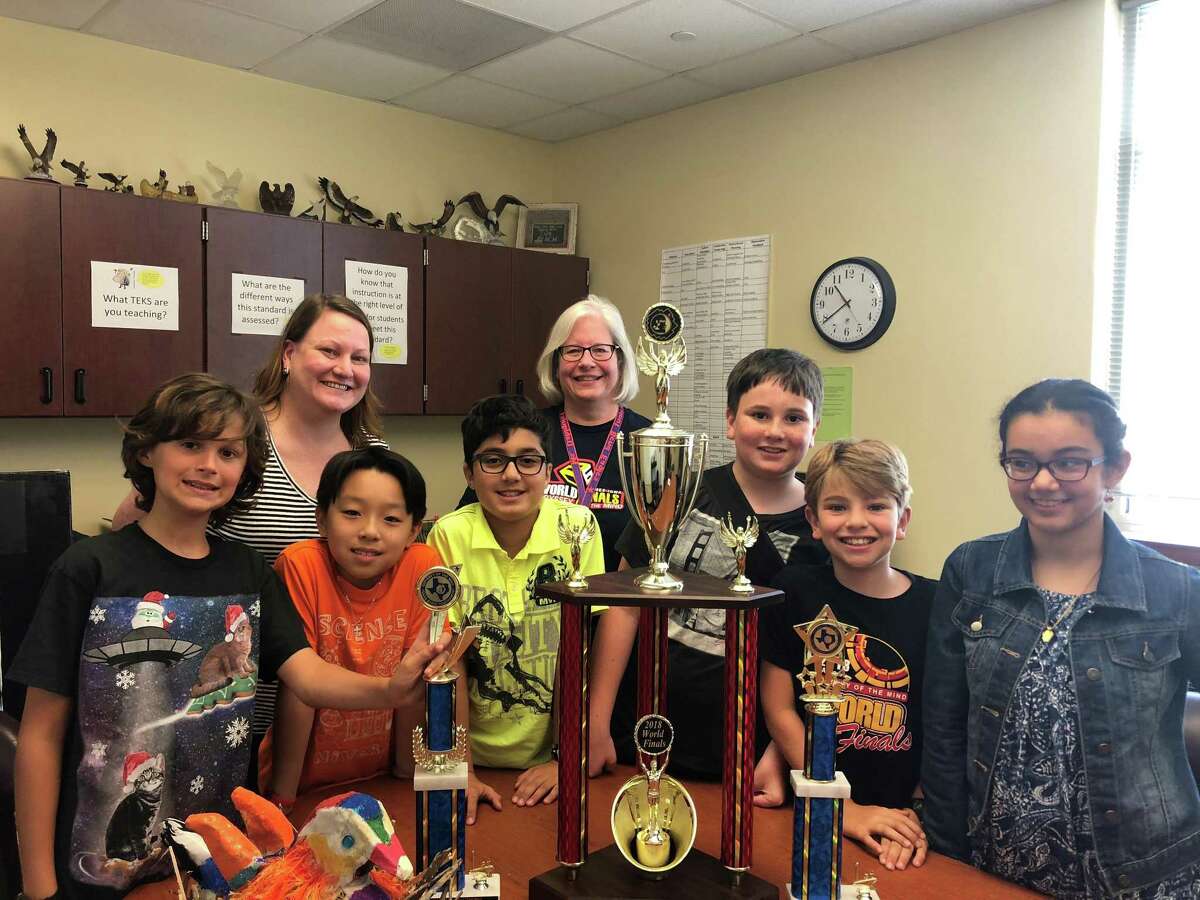The team from Walnut Bend Elementary School won second place in the Odyssey of the Mind World Finals May 23-26 in at Iowa State University. From left to right: Elliot Arntz, WBES registrar and Odyssey Coach Penny Blair, Hans Winata, Ammar Guliyev, WBES Principal and Odyssey Coach Michele Dahlquist, Andrew Blair, Brody Niece and Fatema Al Jawahery. Not pictured: Diamon Green.