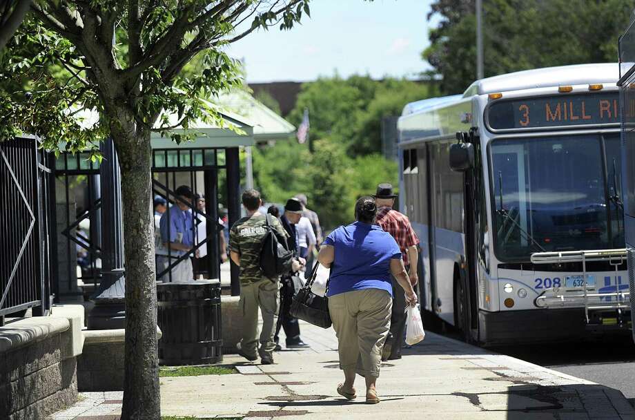 Passengers board  buses at the HARTransit hub on Kennedy Avenue in Danbury Monday, June 25, 2018. Danbury received $2 million in grants from the state to support its plan to revitalize the the area of downtown around the train and bus stations. Photo: Carol Kaliff / Hearst Connecticut Media / The News-Times