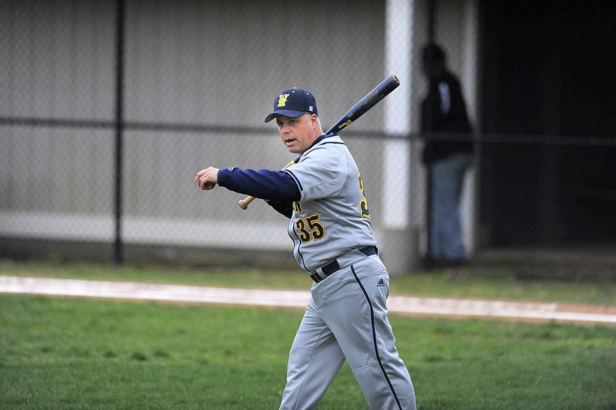 Weston coach Frank Fedeli takes infield batting practice with his players prior to their game against Westhill at Westhill High School on April 6, 2016. Westhill defeated Weston 3-1.