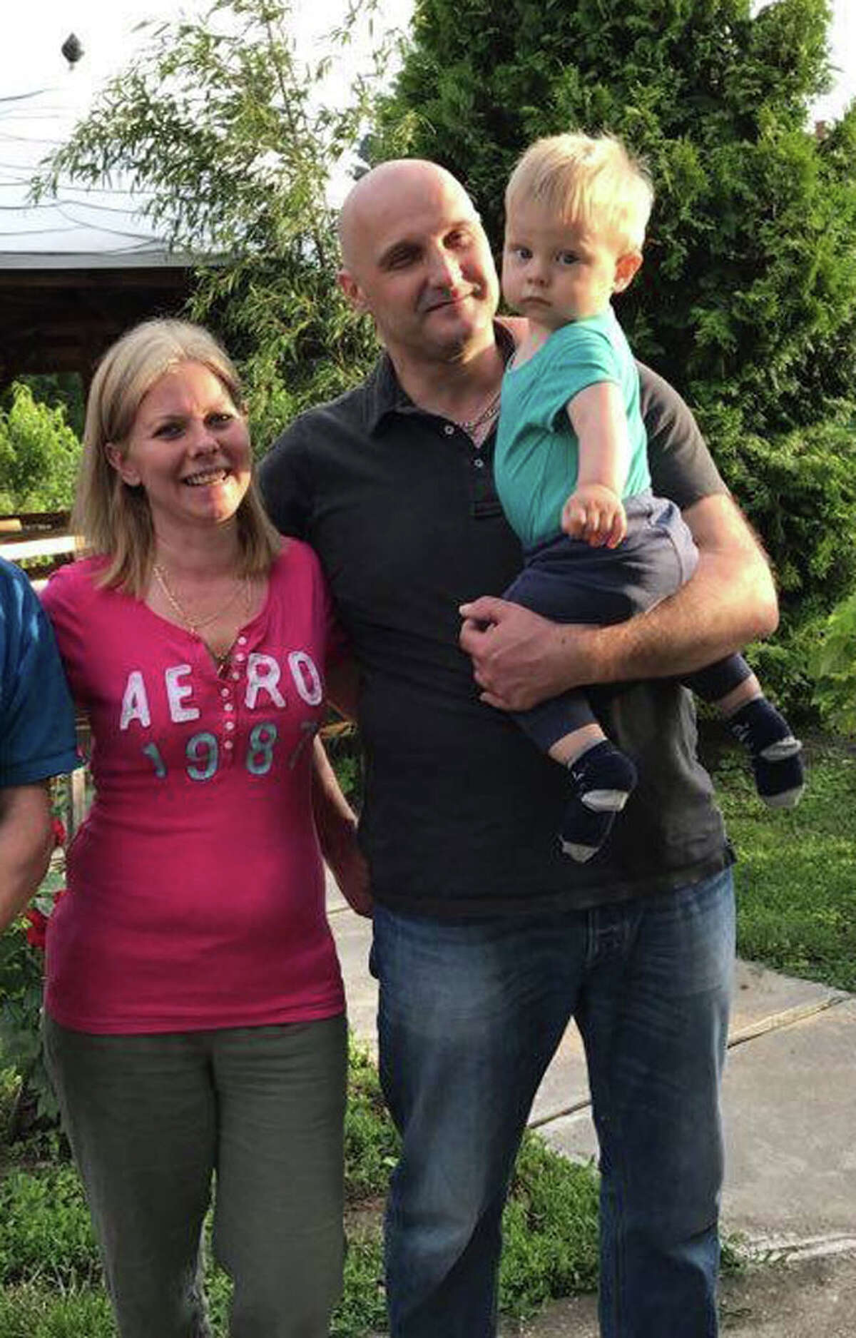 Regina Zsigmond, 42, left, and Laszlo Kovacs, 45, right, with their son, Levente Kovacs, 2. The two-year-old boy is currently being held in a Bronx shelter. (Provided photo)