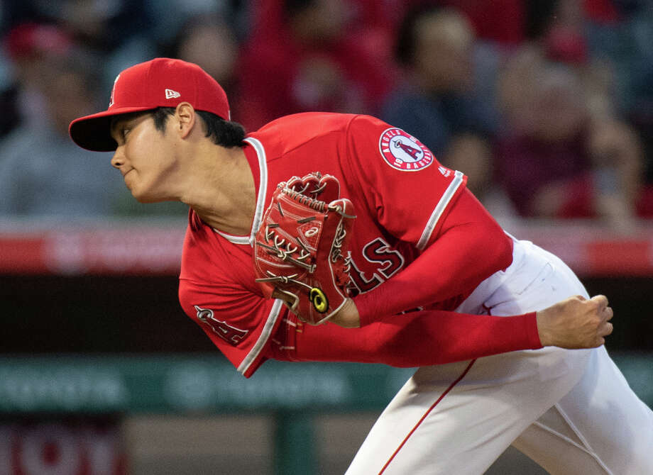 FLE - In this June 6, 2018 file photo Los Angeles Angels starting pitcher Shohei Ohtani watches a pitch during the third inning of a baseball game against the Kansas City Royals in Anaheim, Calif. Ohtani will be re-evaluated within the next three weeks to gauge progress in his recovery from a sprained ligament in his right elbow. Angels manager Mike Scioscia announced the slight adjustment to Ohtanis timeline Monday, June 18, 2018 before his club opened an interleague series against Arizona. (AP Photo/Kyusung Gong, file) Photo: Kyusung Gong / AP