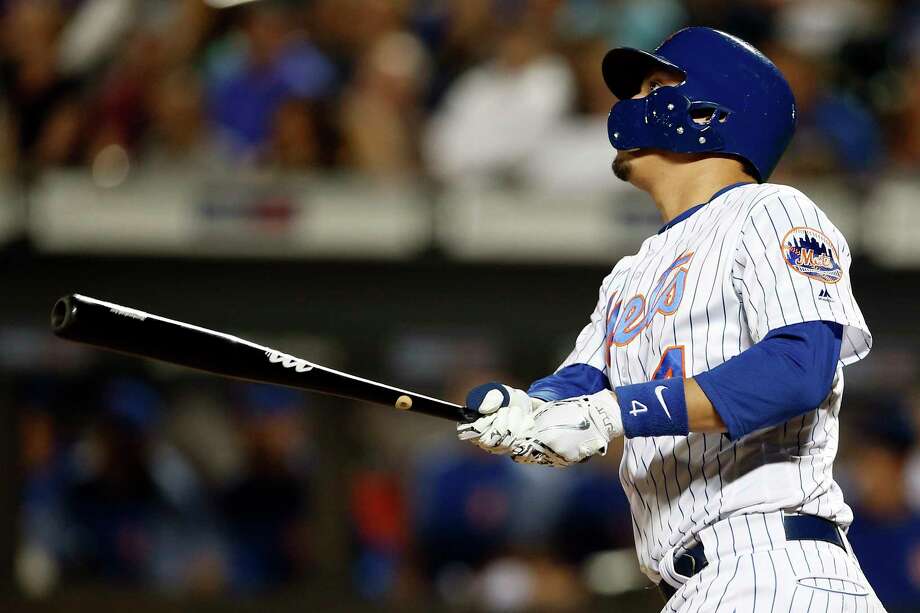 New York Mets Wilmer Flores watches a three-run home run during the seventh inning of a baseball game against the Pittsburgh Pirates on Monday, June 25, 2018, in New York. (AP Photo/Adam Hunger) Photo: Adam Hunger / FR110666 AP