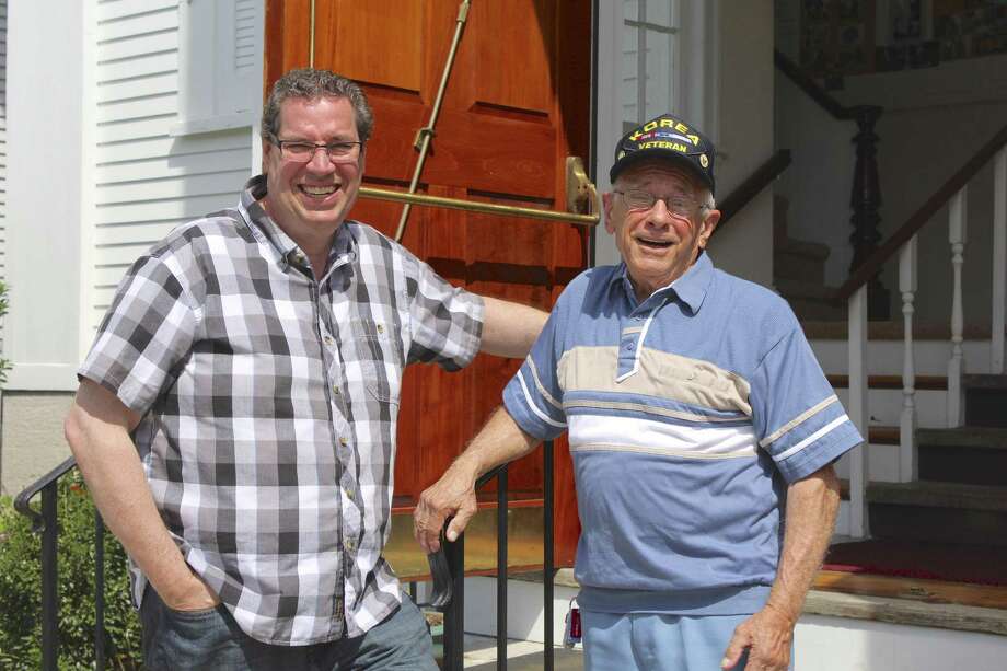 Korean War veteran Bernie Rotunda (right) from Bethel stands with Pastor John Parille (left) in front of Bethel United Methodist Church, one of the churches that will ring its bells 13 times at 2 p.m. on the Fourth of July. More than 20 churches across the Danbury area will ring their bells in a show of patriotism. Photo: Julia Perkins / Hearst Connecticut Media / The News-Times
