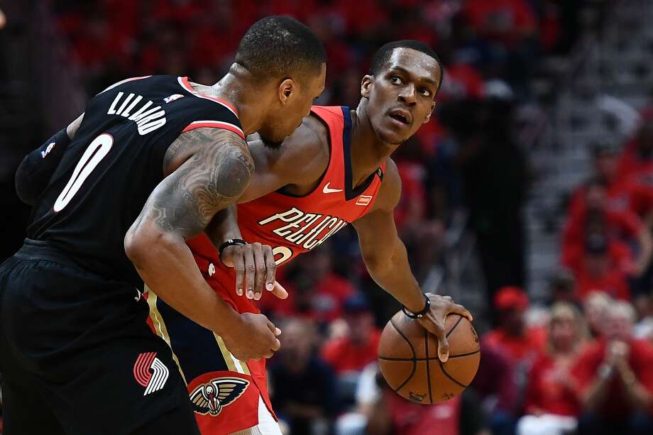 NEW ORLEANS, LA - APRIL 21: Rajon Rondo #9 of the New Orleans Pelicans is defended by Damian Lillard #0 of the Portland Trail Blazers during Game Four of the first round of the Western Conference playoffs at the Smoothie King Center on April 21, 2018 in New Orleans, Louisiana. The Pelicans defeated the Trail Blazers 131-123 to sweep the series 4-0. Photo by Stacy Revere/Getty Images) Photo: Stacy Revere/Getty Images