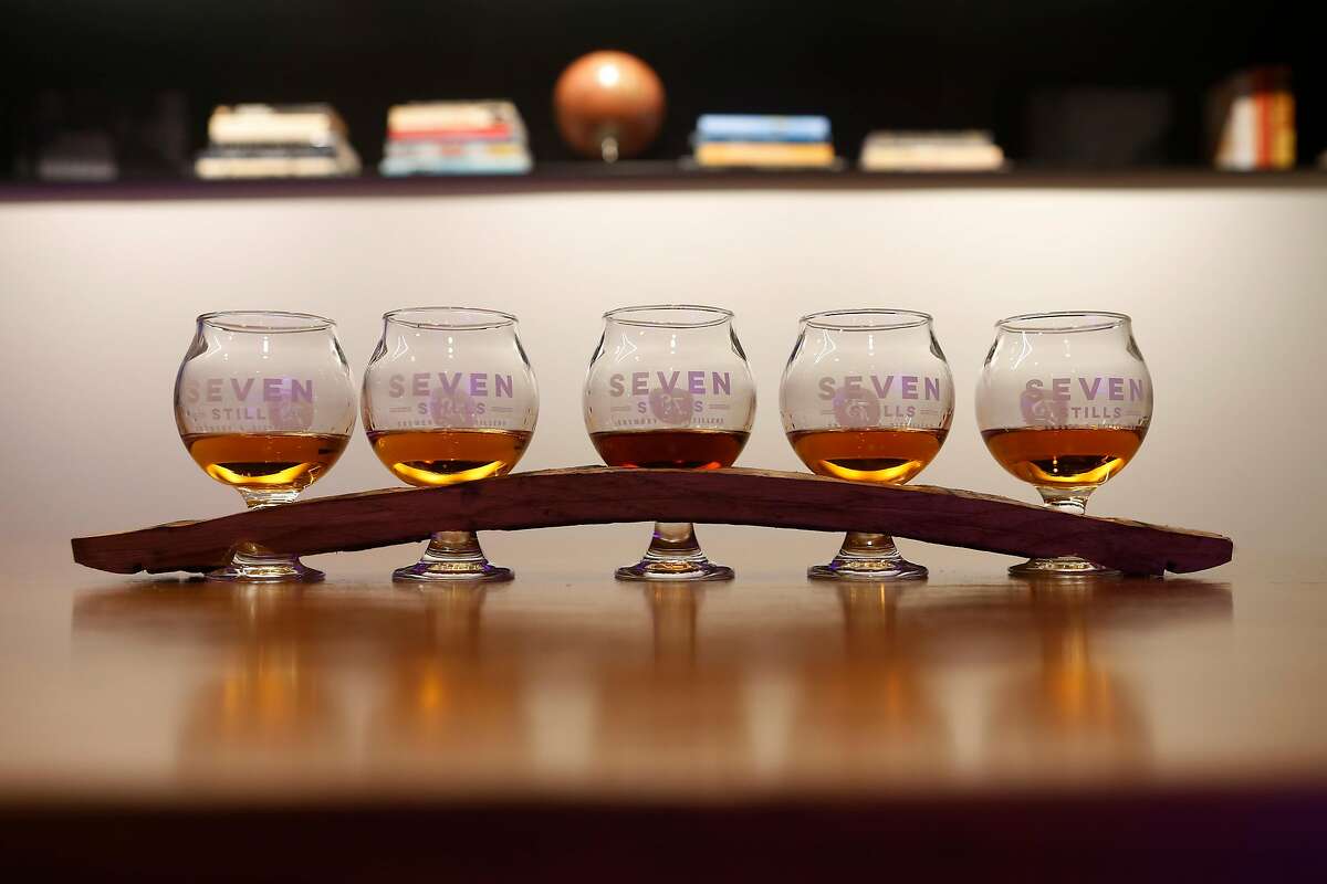 A whiskey flight, top, at Seven Stills’ Nob Hill bar located inside the Stanford Court Hotel. 