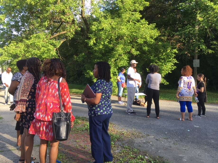 Arbor Hill residents gather on a vacant lot on Henry Johnson Blvd. and First Street to discuss how to save the neighborhood from drugs and violence. Photo: Wendy Liberatore/Times Union