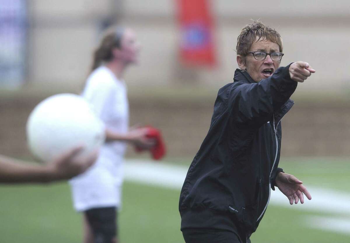 Reagan soccer coach Frankie Whitlock asks for clarification from an official during girls UIL Class 5A state semifinal soccer action against West Plano in Georgetown on Thursday, April 17, 2014.