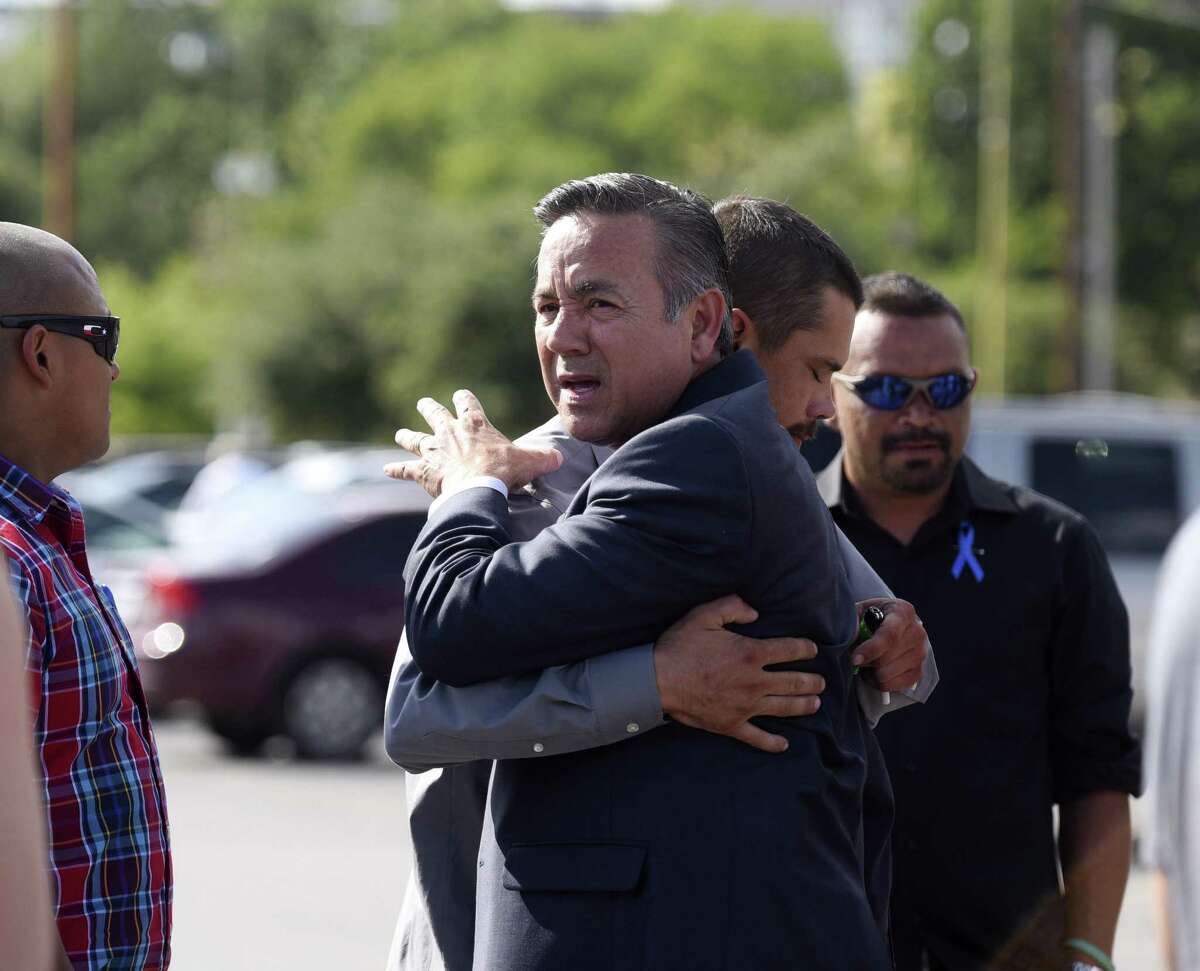 State Sen. Carlos Uresti is embraced by a supporter after leaving the San Antonio federal courthouse after being sentenced for his criminal conviction in the FourWinds Logistics case on Tuesday, June 26, 2018.