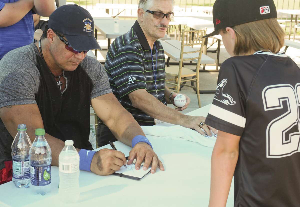 Jose Conseco and Rollie Fingers sign autographs 06/26/18 for baseball fans before the Texas League All-Star Game at Security Bank Ballpark. Tim Fischer/Reporter-Telegram