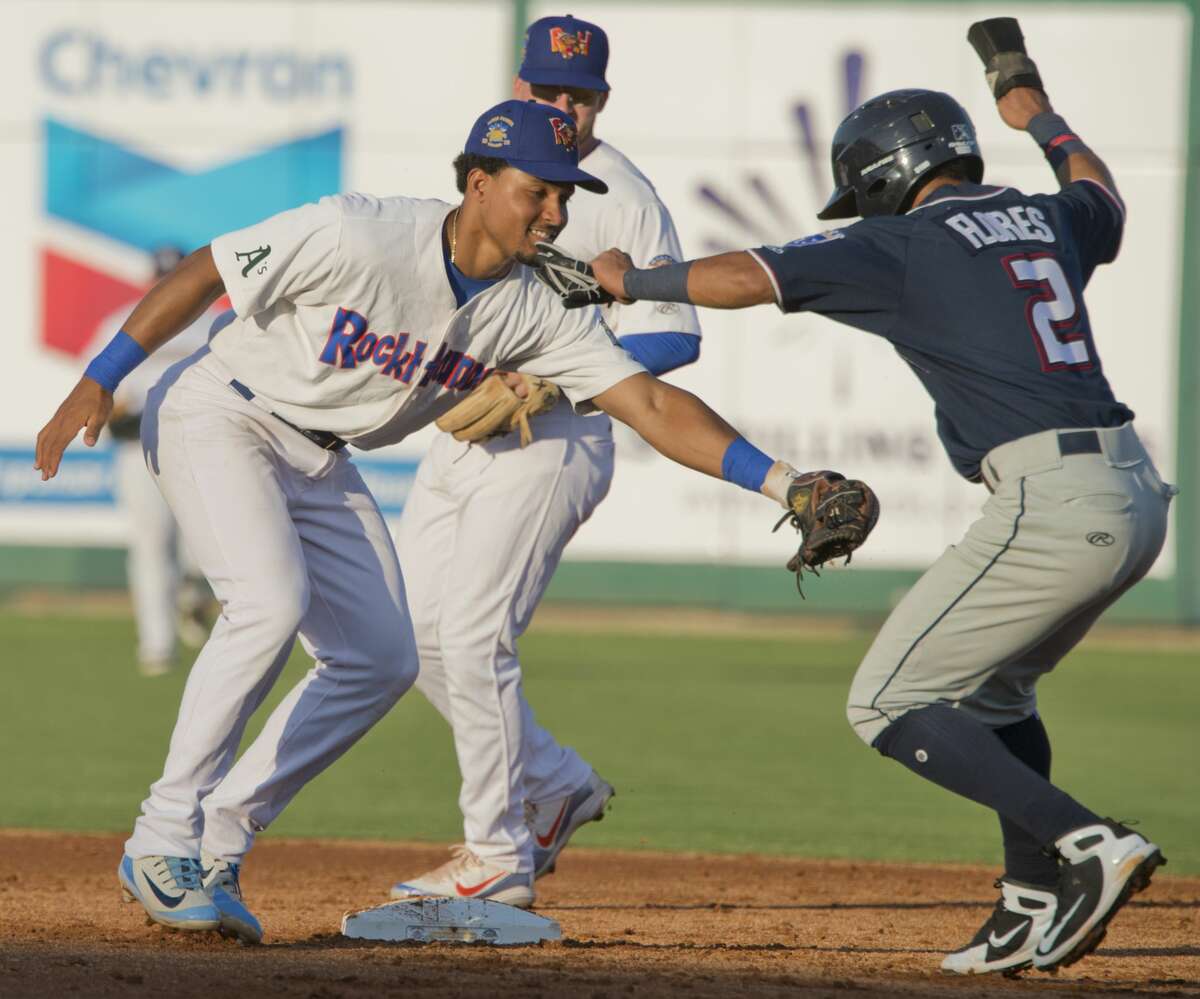 RockHounds' Richie Martin tries to put the tag on North's Jecksson Flores as he tries to steal second and gets caught in a run down back to first 06/26/18 at the Texas League All-Star Game at Security Bank Ballpark. Tim Fischer/Reporter-Telegram