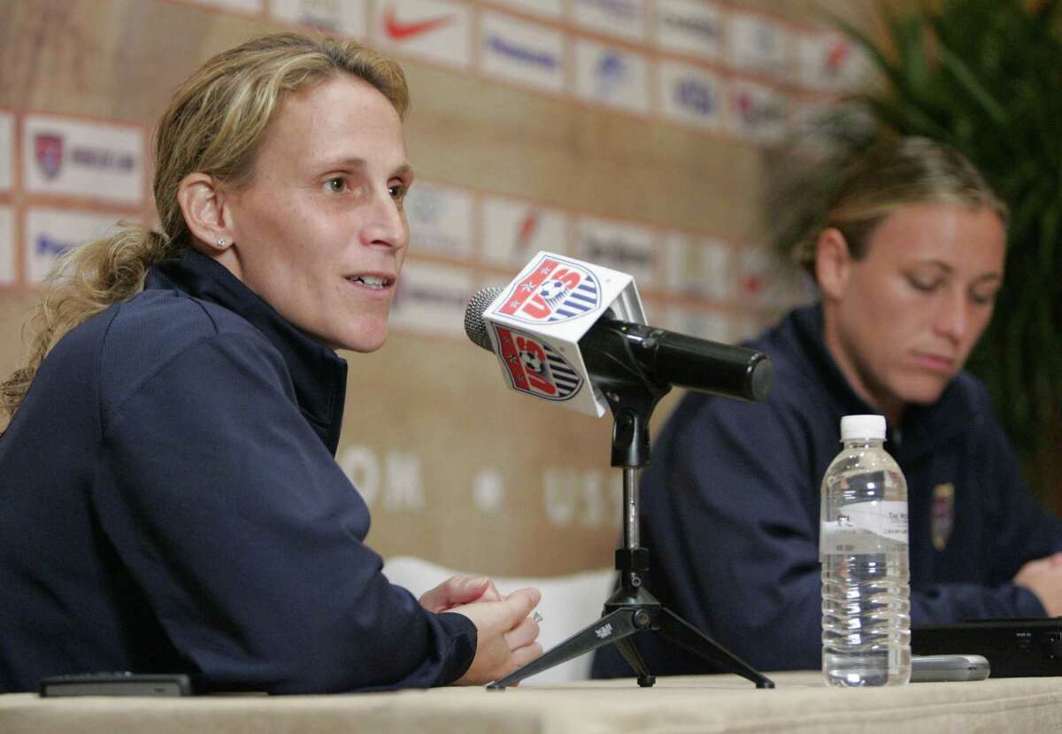 United States women's national soccer team Kristine Lilly, left, and forward Abby Wambach answer questions during a press conference Saturday, Sept. 29, 2007 in Shanghai. Lilly discussed the team's decision to exclude goal keeper Hope Solo from the last training session and from Sunday's third place match against Norway in the consolation match of the FIFA 2007 Women's World Cup soccer tournament on Sunday. Solo publicly questioned coach Greg Ryan's decision to play keeper Briana Scurry against Brazil in the semi final match. (AP Photo/Julie Jacobson)