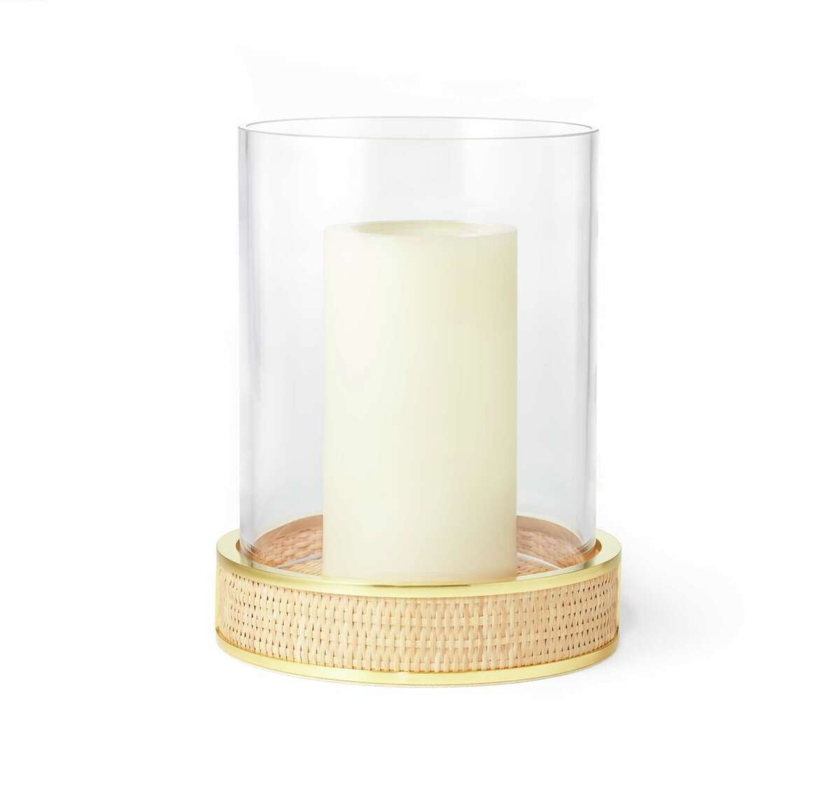 Colette Hurricane Lamp:Â Bring out Aerin?s Colette Cane hurricane lamp for summer entertaining, or keep it busy year-round in your beach house. The eight-inch-tall glass vase rests in a stylish base of woven cane and brass. $375; www.aerin.com