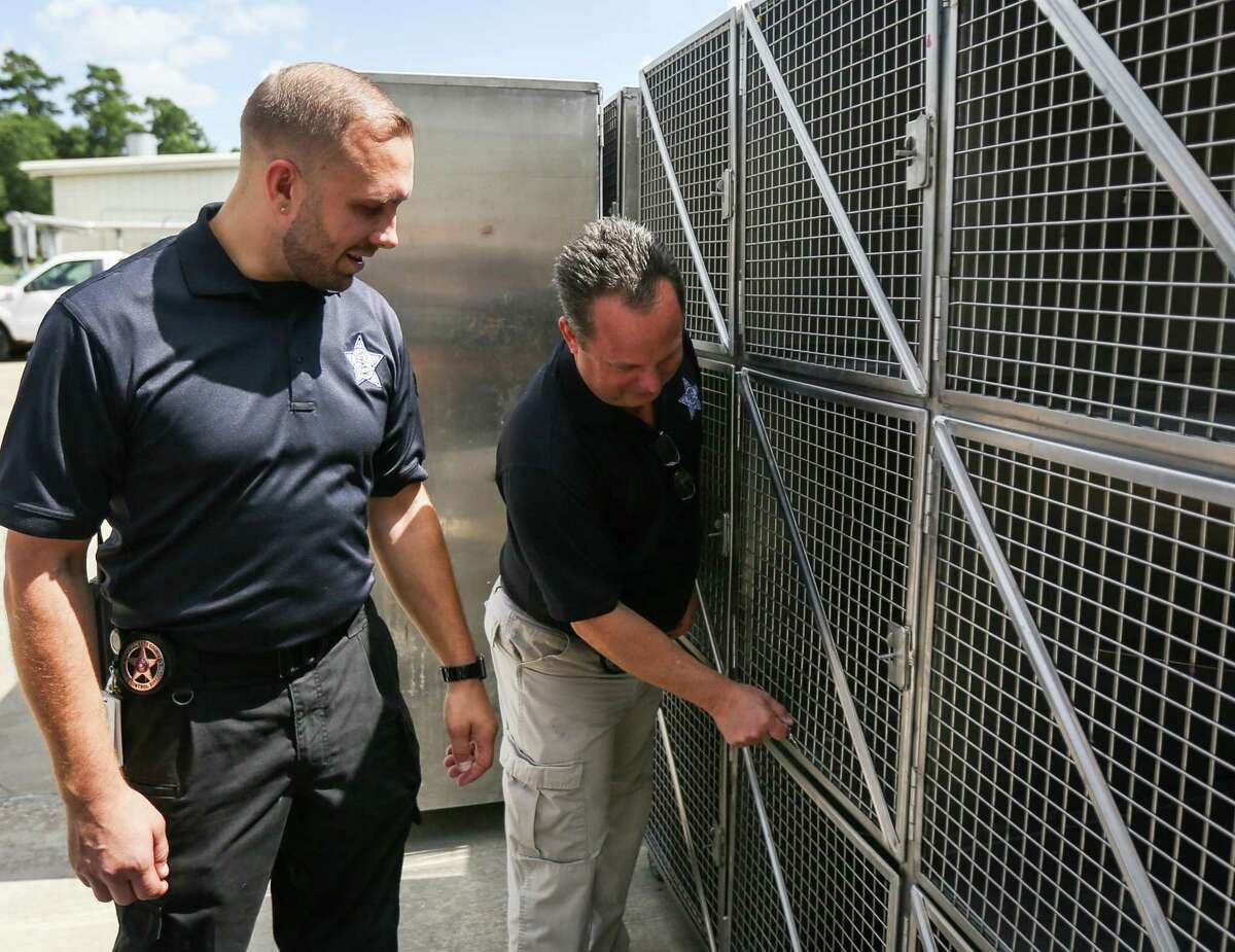 Director Aaron Johnson, left, and assistant director Mark Wysocki, both of the Montgomery County Animal Shelter, show the differences between the old kennels the shelter used, and new ones that were custom built, on Tuesday, June 26, 2018, at the Montgomery County Animal Shelter.