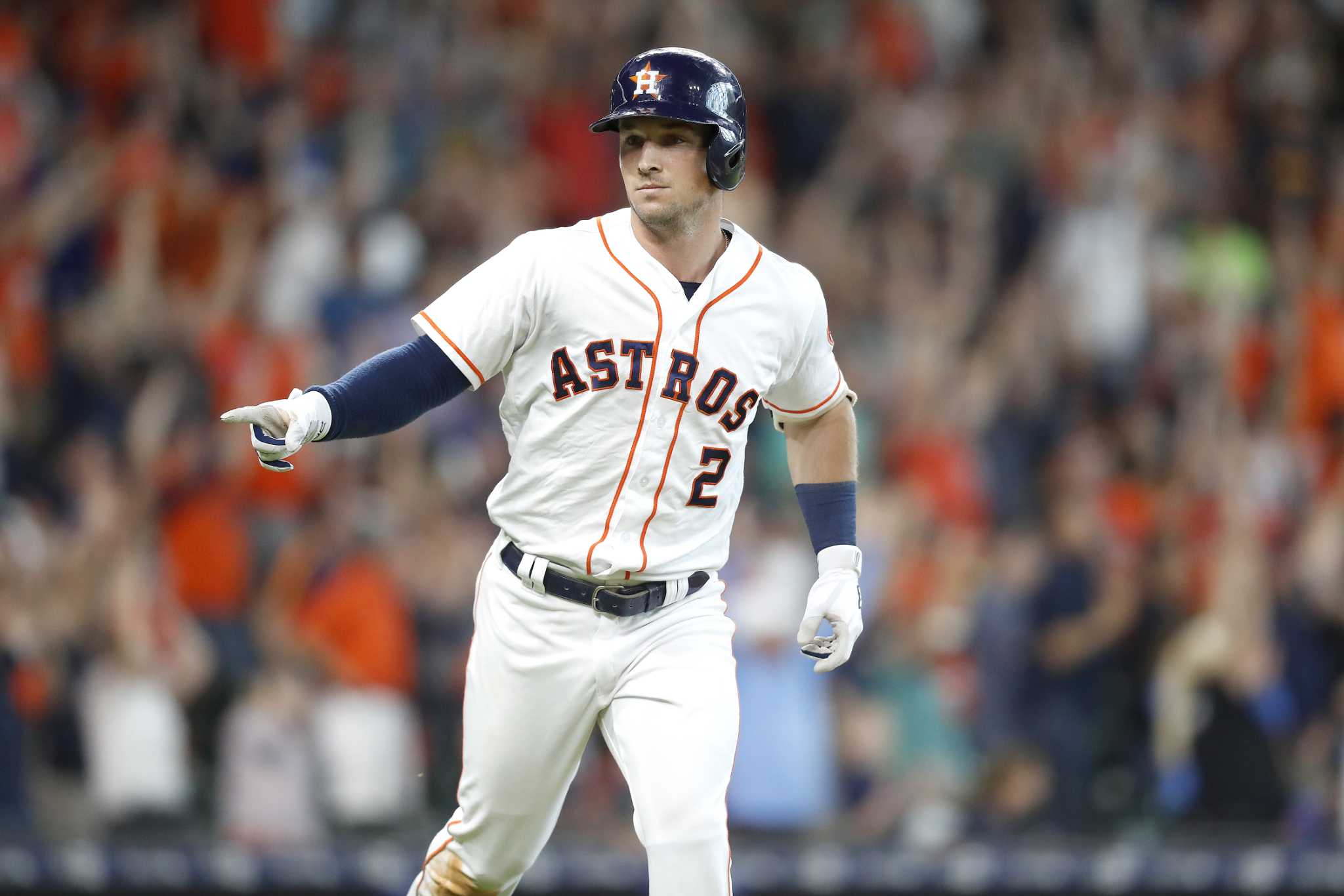 Toronto Blue Jays' Randal Grichuk reacts towards the Houston Astros' dugout  during a video replay of Grichuk being called safe at first during the  eighth inning of a baseball game against the