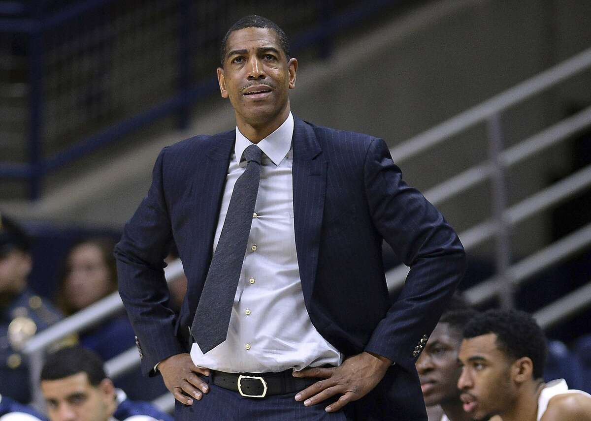 FILE - In this Feb. 7, 2018, file photo, Connecticut head coach Kevin Ollie watches from the sideline during the first half an NCAA college basketball game in Storrs, Conn. Ollie was fired in March amid an NCAA investigation. In response to open records requests from The Associated Press and other news organizations, UConn president Susan Herbst on Monday, June 25, released a June 19 letter upholding Ollie's firing, which said the former men's basketball coach had a pattern of breaking NCAA rules and committed serious violations. (AP Photo/Jessica Hill, File)