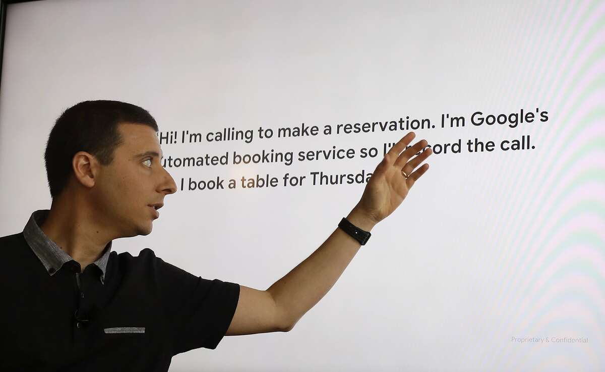 In this Tuesday, June 26, 2018, photo Nick Fox, VP of Assistant and Search for Google, talks about the Duplex program, which allows the user to book an appointment over the phone, at Oren's Hummus Shop in Mountain View, Calif. (AP Photo/Marcio Jose Sanchez)