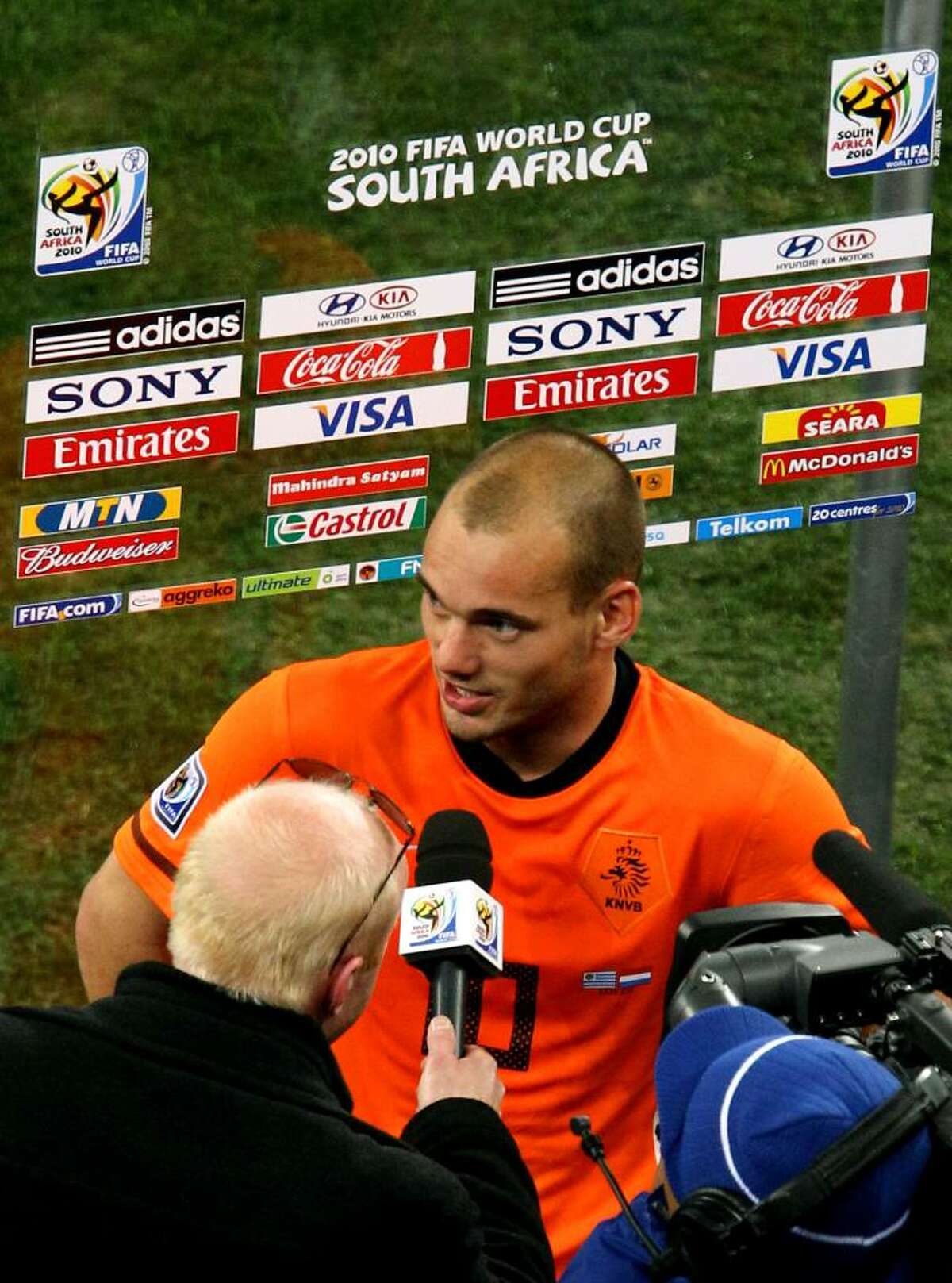 CAPE TOWN, SOUTH AFRICA - JULY 06: Man of the match Wesley Sneijder of the Netherlands is interviewed following the 2010 FIFA World Cup South Africa Semi Final match between Uruguay and the Netherlands at Green Point Stadium on July 6, 2010 in Cape Town, South Africa. (Photo by Richard Heathcote/Getty Images) *** Local Caption *** Wesley Sneijder