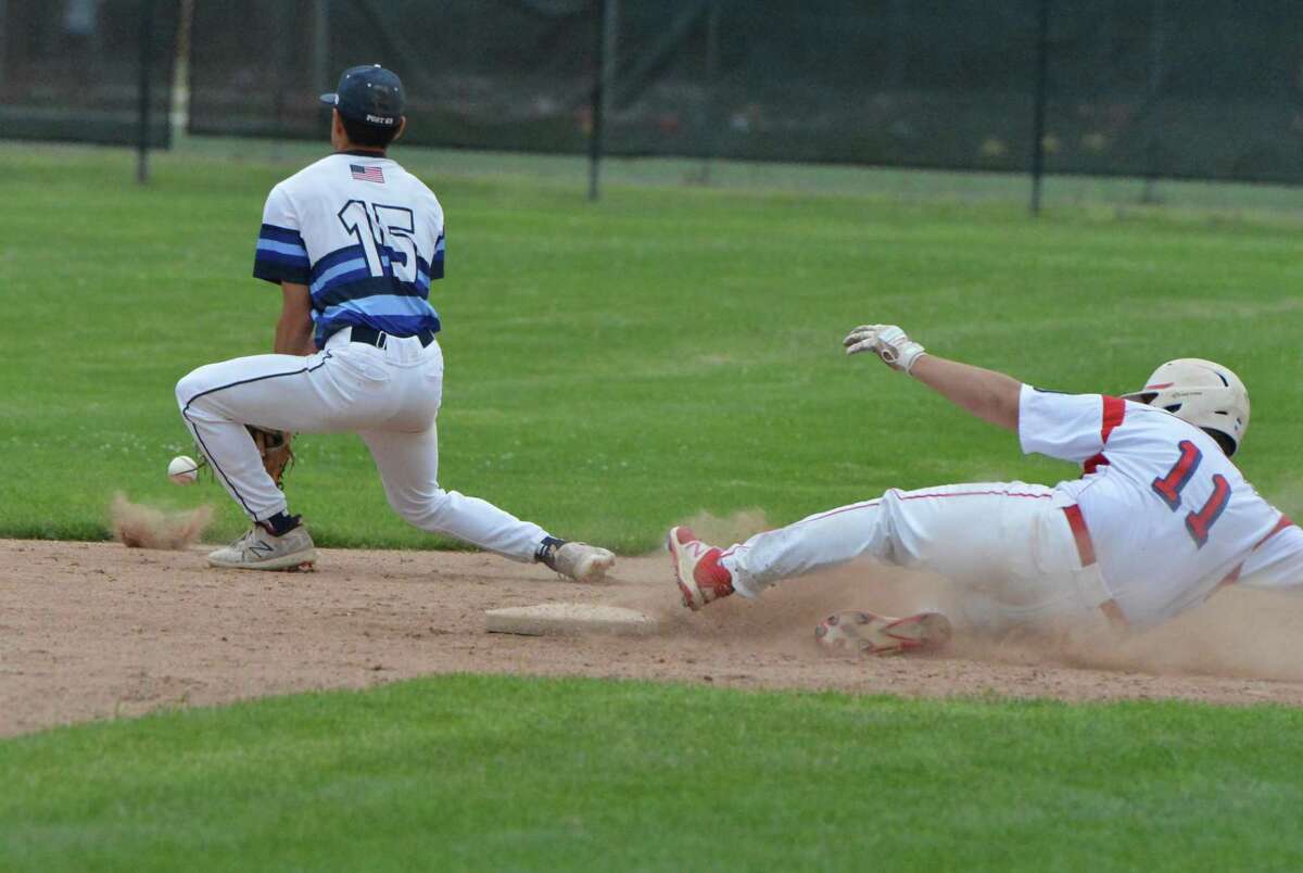 Greenwich’s Hunter Gruenstrass slides safely into second base against Westport during an American Legion baseball game in Greenwich.