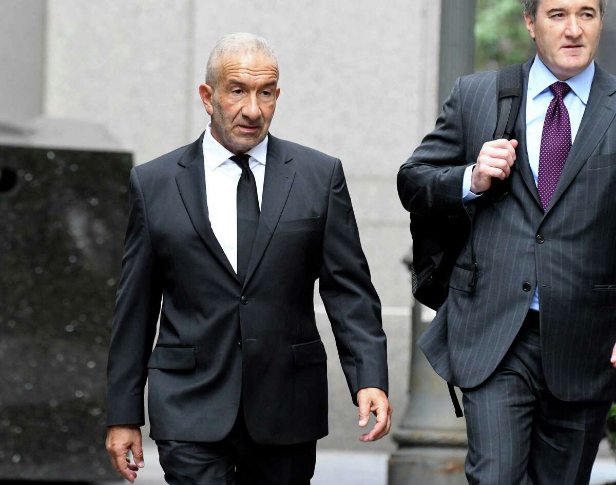 Alain Kaloyeros, former president of the State University of New York's Polytechnic Institute, left, arrives at federal court in New York, U.S., on Tuesday, June 19, 2018. Kaloyeros is accused of conspiring with construction and real estate executives from COR Development in Syracuse and LPCiminelli in Buffalo to rig bids for lucrative projects in Buffalo and Syracuse tied to the Buffalo Billion project, a New York state government project led by Governor Andrew Cuomo. Photographer: Louis Lanzano/Bloomberg
