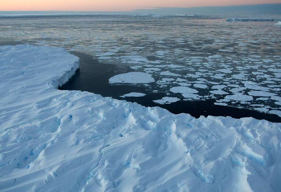 Giant tabular icebergs surrounded by ice floe drift in Vincennes Bay in the Australian Antarctic Territory on January 11, 2008. Australia's CSIRO's atmospheric research unit has found the world is warming faster than predicted by the United Nations' top climate change body, with harmful emissions exceeding worst-case estimates. Photo: TORSTEN BLACKWOOD, AFP/Getty Images