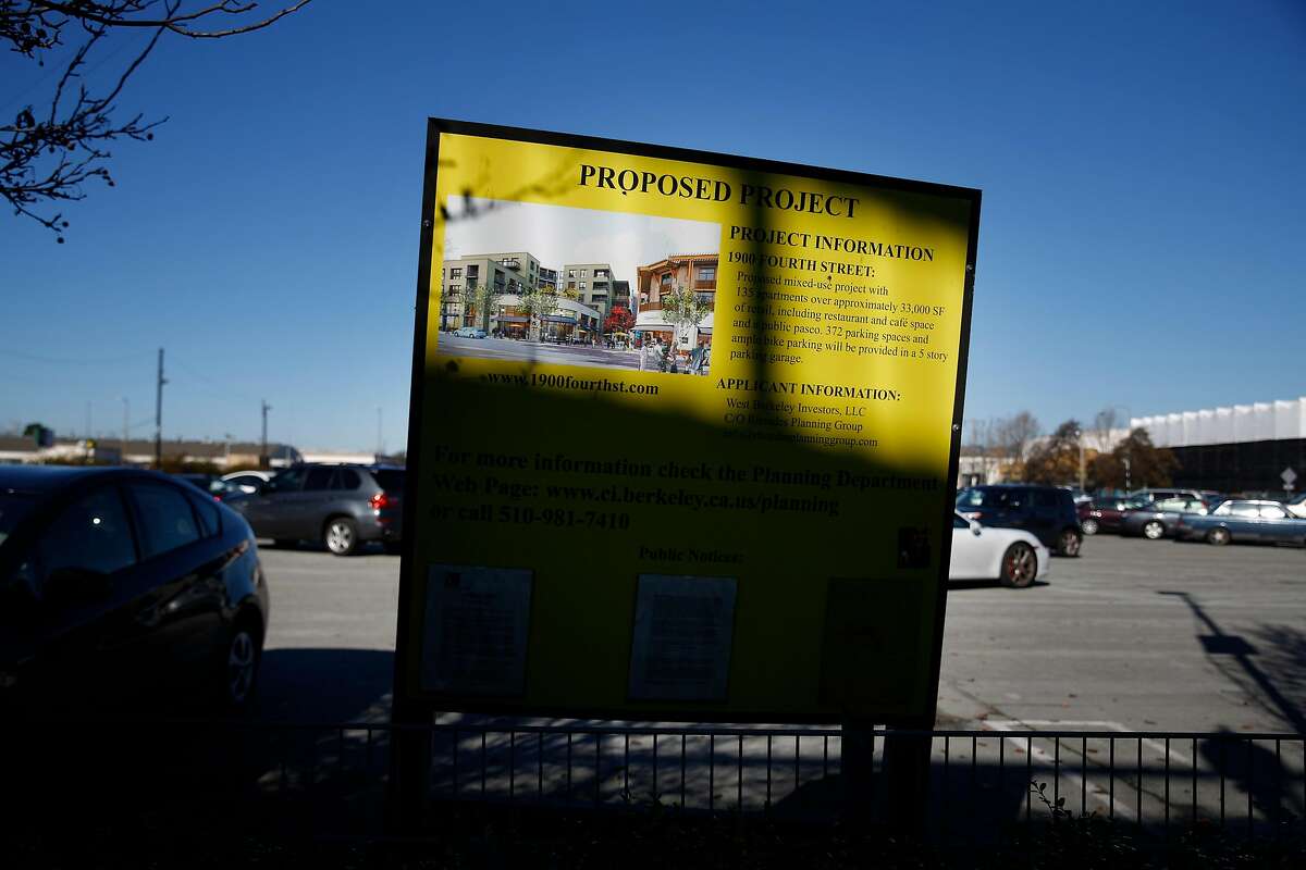 A sign for a proposed project is seen next to the Spenger's Fresh Fish Grotto parking lot, where a development is being proposed that would destroy 5,000 year old Native American burial remains currently beneath the parking lot on Friday, January 13, 2017 in Berkeley, Calif.