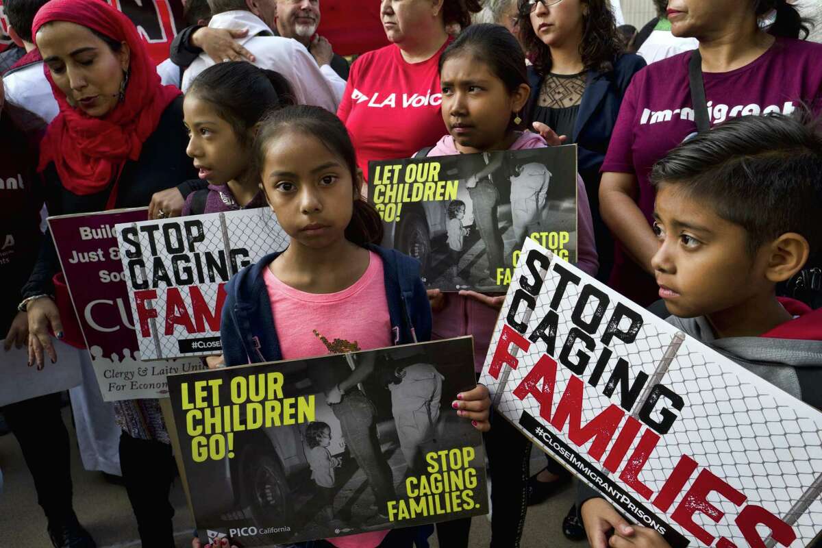 Children attend a rally in front of federal courthouse in Los Angeles on Tuesday. The president’s reversal on family separation is an indication that he fears he has gone too far with his “evil immigrant” strategy.