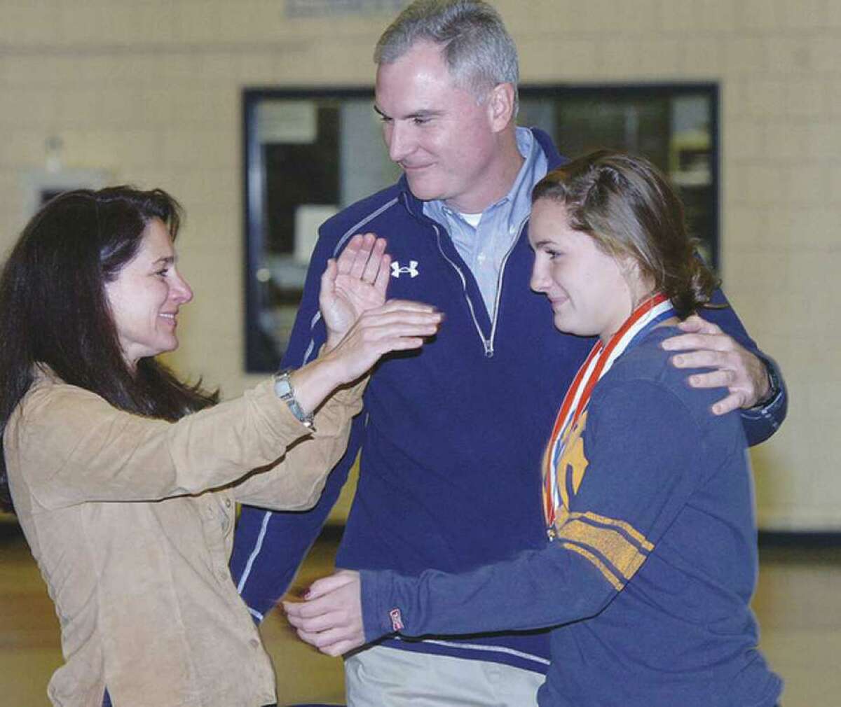 Wilton boys lacrosse coach Steve Pearsall, center, stands with his family during an awards ceremony at the school in 2013. After 10 years as an assistant, Pearsall was named head coach of the Warriors program this week.