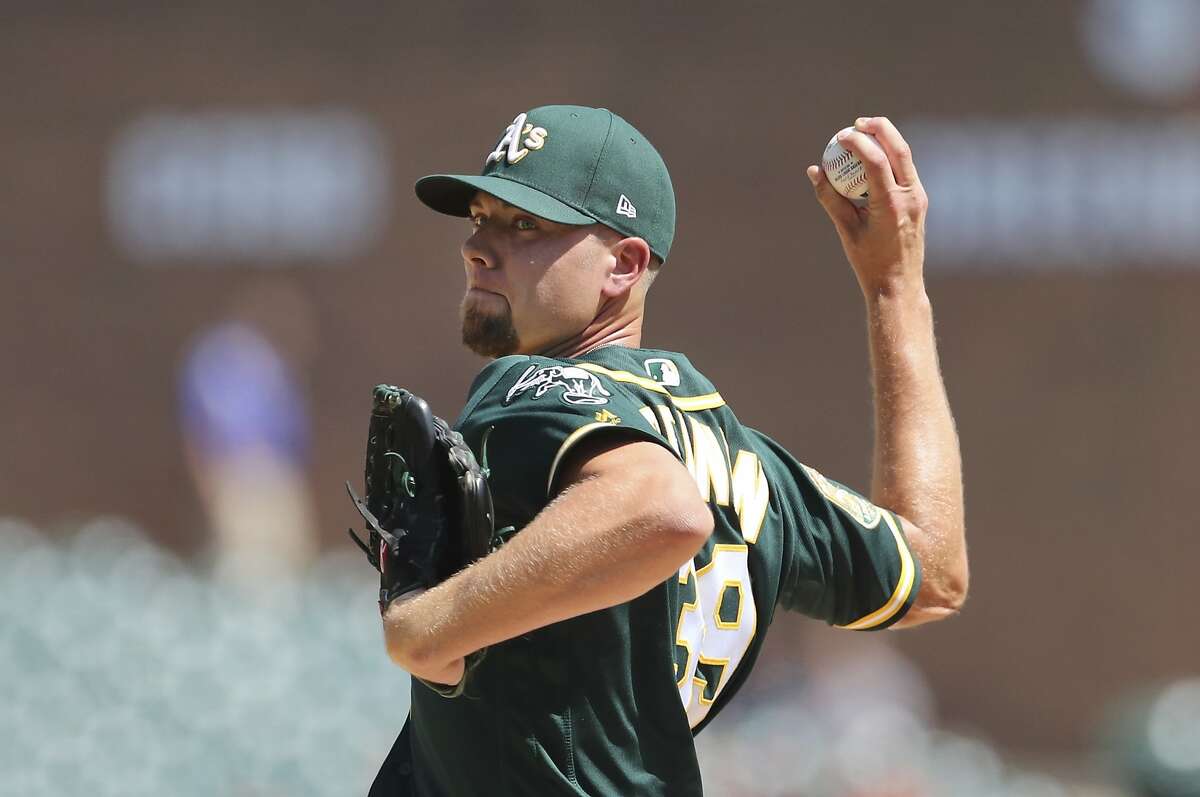 Oakland Athletics relief pitcher Blake Treinen throws during the ninth inning of a baseball game against the Detroit Tigers, Thursday, June 28, 2018, in Detroit. (AP Photo/Carlos Osorio)
