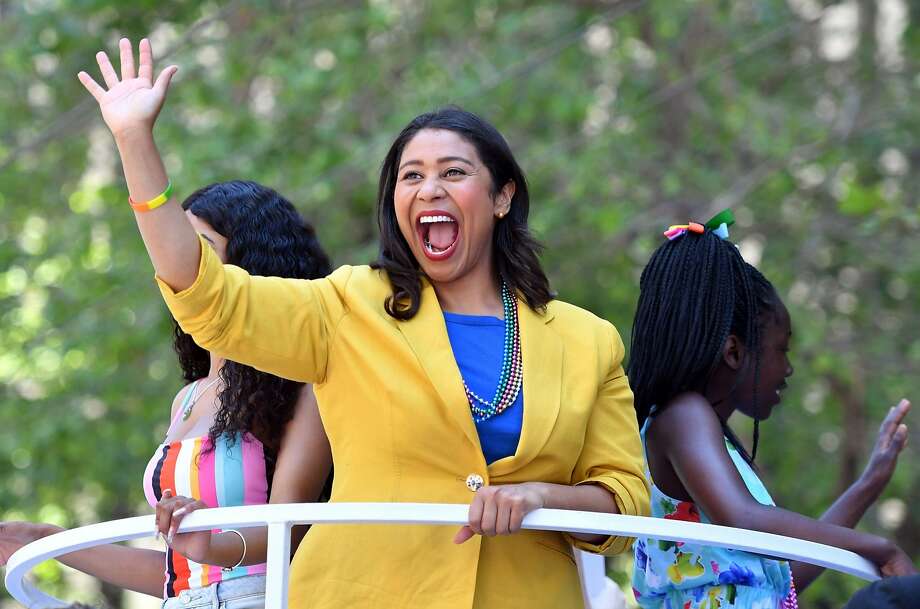 San Francisco Mayor-elect London Breed waves to a cheering crowd atop a float during the San Francisco Pride Parade last month. Photo: Josh Edelson / AFP / Getty Images