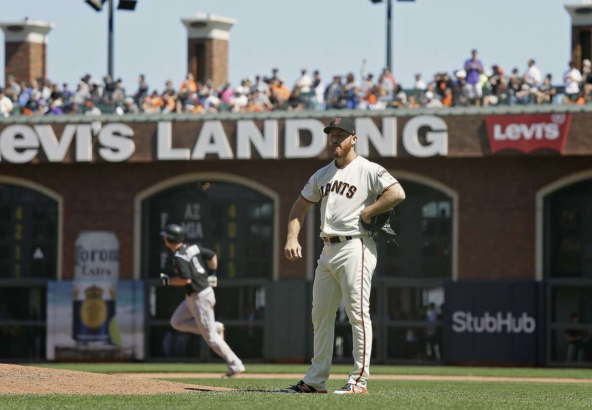 San Francisco Giants relief pitcher Sam Dyson stands on the mound after giving up a two-run home run to the Colorado Rockies' DJ LeMahieu in the ninth inning of a baseball game Thursday, June 28, 2018, in San Francisco. Colorado won the game 9-8. (AP Photo/Eric Risberg)
