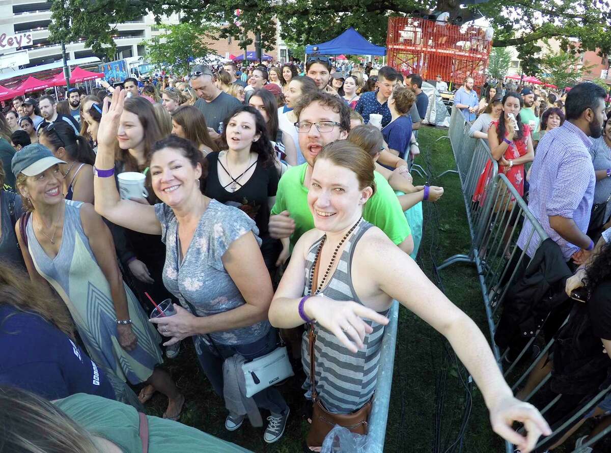 Dina Cashman of Milford dances to the music as she waits with friends for the performance of Gavin DeGraw at the Alive@Five concert series in Columbus Park on June 28, 2018 in Stamford, Connecticut.