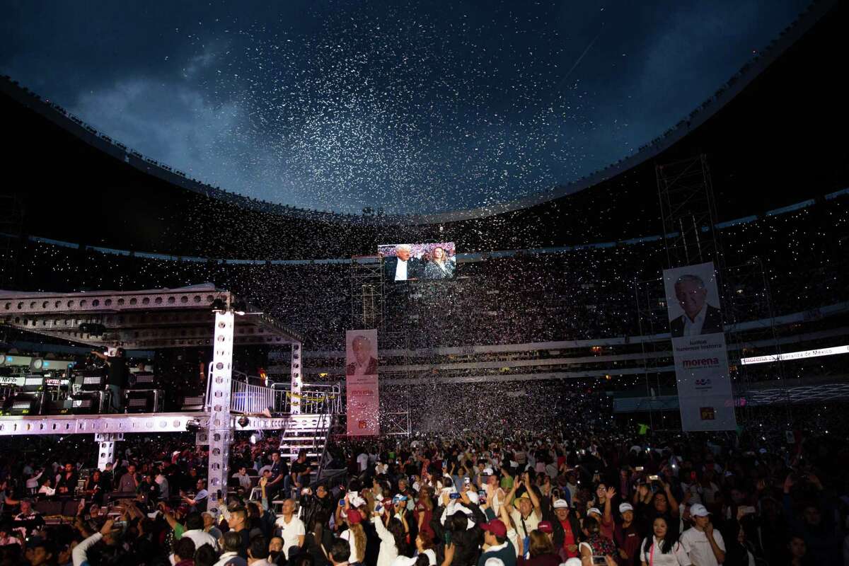 Confetti falls as supporters attend the final campaign rally for Andres Manuel Lopez Obrador, presidential candidate of the National Regeneration Movement Party (MORENA), at the Estadio Azteca in Mexico City, Mexico, on Wednesday, June 27, 2018. Lopez Obrador promises to put the poor first with a raft of new social programs -- and to stand up to the U.S. President, who has been denouncing Mexico since before he got elected. Photographer: Alejandro Cegarra/Bloomberg