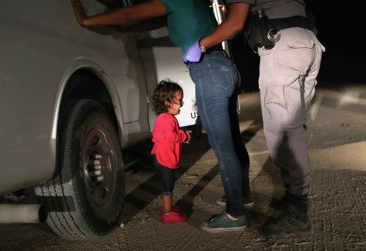MCALLEN, TX - JUNE 12: A two-year-old Honduran asylum seeker cries as her mother is searched and detained near the U.S.-Mexico border on June 12, 2018 in McAllen, Texas. The asylum seekers had rafted across the Rio Grande from Mexico and were detained by U.S. Border Patrol agents before being sent to a processing center for possible separation. Customs and Border Protection (CBP) is executing the Trump administration's "zero tolerance" policy towards undocumented immigrants. U.S. Attorney General Jeff Sessions also said that domestic and gang violence in immigrants' country of origin would no longer qualify them for political asylum status. (Photo by John Moore/Getty Images)