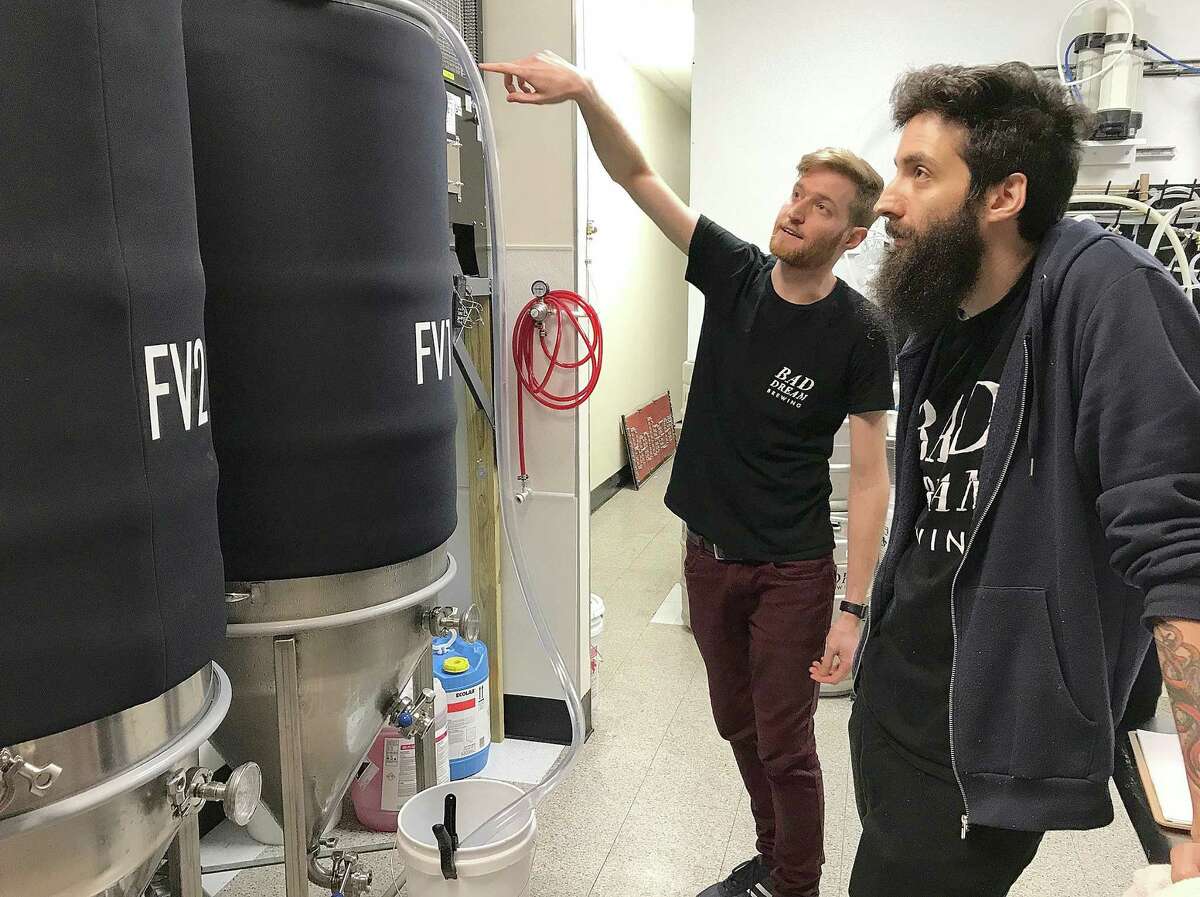 Bad Dream Brewing's Brian Benzinger and Max Retter explain the three-barrell brewing system at their new brewery and taproom at 116 Danbury Road (Route 7) in New Milford, Conn., on Thursday, June 28, 2018.