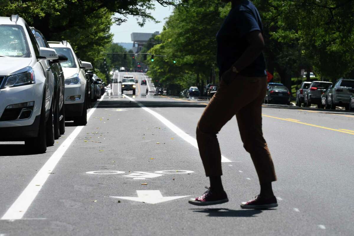 A pedestrian crosses Madison Ave. at S. Lake on Friday, June 29, 2018, in Albany, N.Y. Mayor Kathy Sheehan held a press conference to highlight the completion of the major components of the second and final phase of the Madison Avenue Street Calming project. (Will Waldron/Times Union)