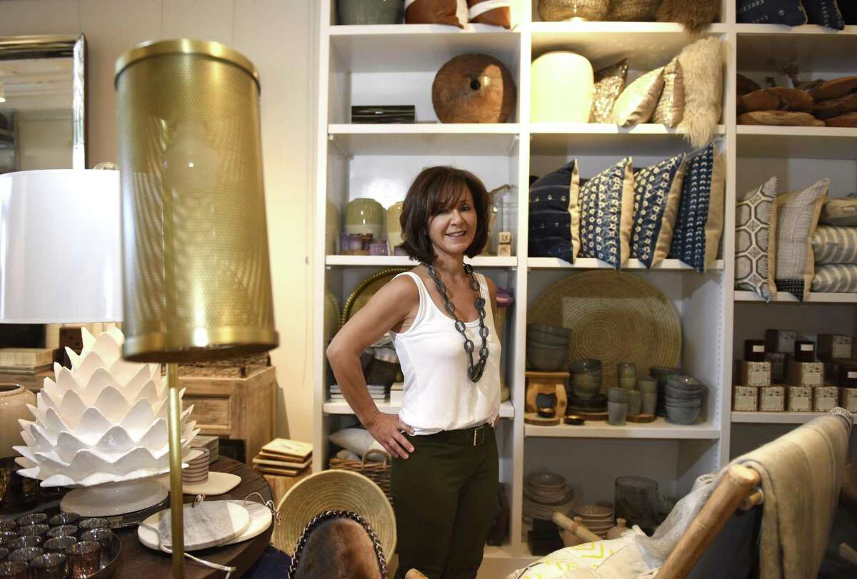 Owner Kim Caravella poses at the new Habitat Greenwich interior design store in the Cos Cob section of Greenwich, Conn. Tuesday, June 26, 2018. The shop, which will have its soft opening Saturday, June 30, features a variety of interior pieces from near and far, many of which are made by fair trade small businesses.