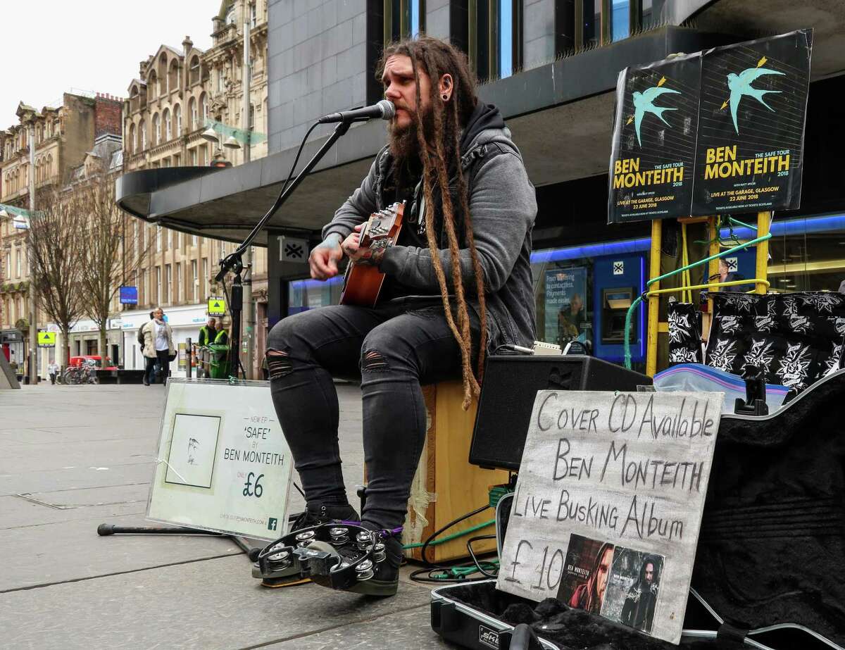 Busker Ben Monteith performs on Glasgow’s Buchanan Street.