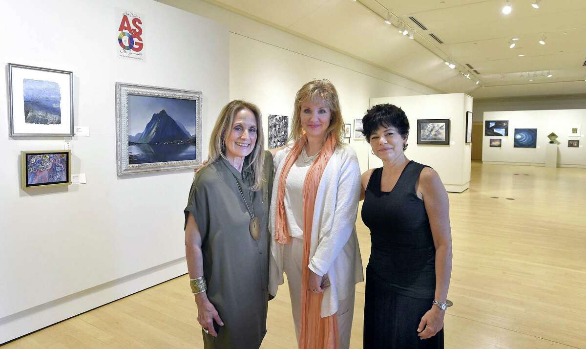 From left, Elaine Conner of Greenwich, Reese Anderson Green of Westport and Julie DiBiase of Stamford of the Art Society of Old Greenwich are photograph at the Greenwich Library Flinn Gallery on June 29, 2018 in Greenwich, Connecticut. Conner and DiBiase are co-presidents of ASOG, and Green co-chairs "Escape" the annual members juried exhibit on display at the gallery through July 18, 2018.