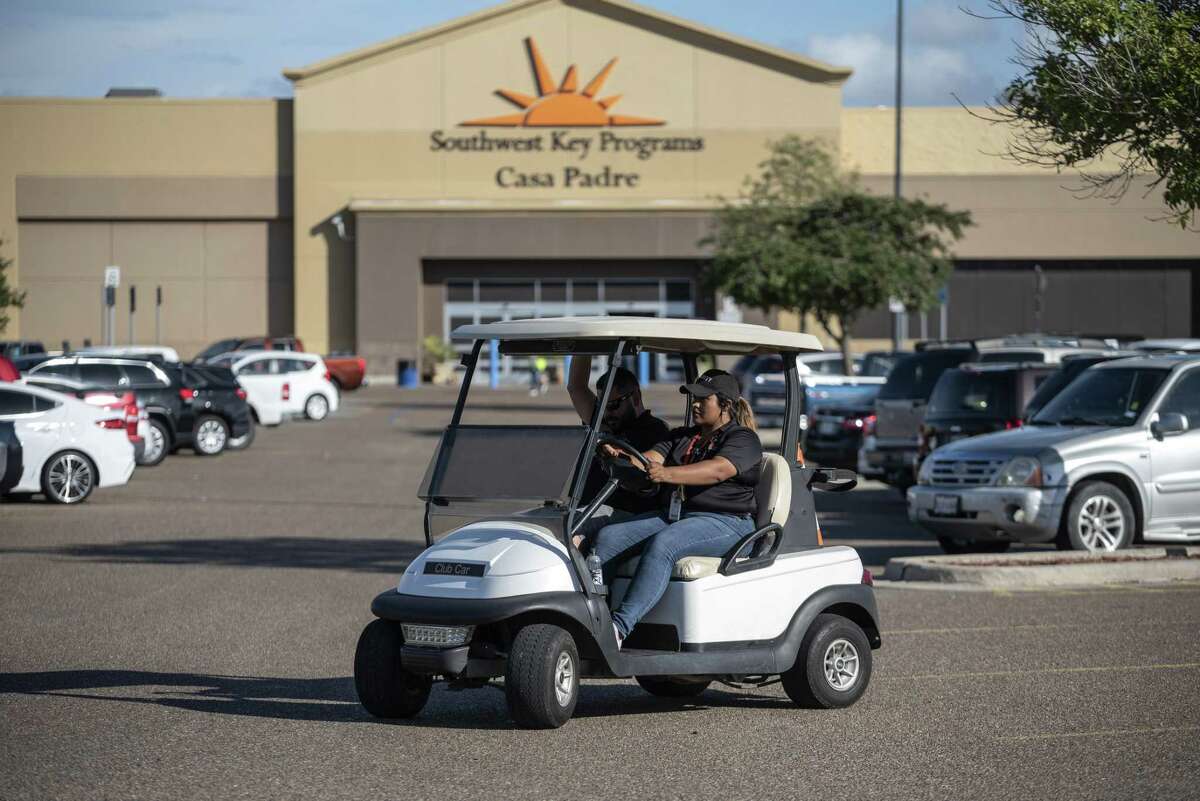 Security guards monitor the perimeter of the Southwest Key-Casa Padre Facility, formerly a Walmart Inc. store, in Brownsville, Texas, U.S., on Sunday, June 17, 2018. Democrats escalated their attacks on President Donald Trump's policy of separating immigrant children from parents who illegally cross the Mexican border, as public outrage over the practice balloons into an election-year headache for Republicans. Photographer: Sergio Flores/Bloomberg